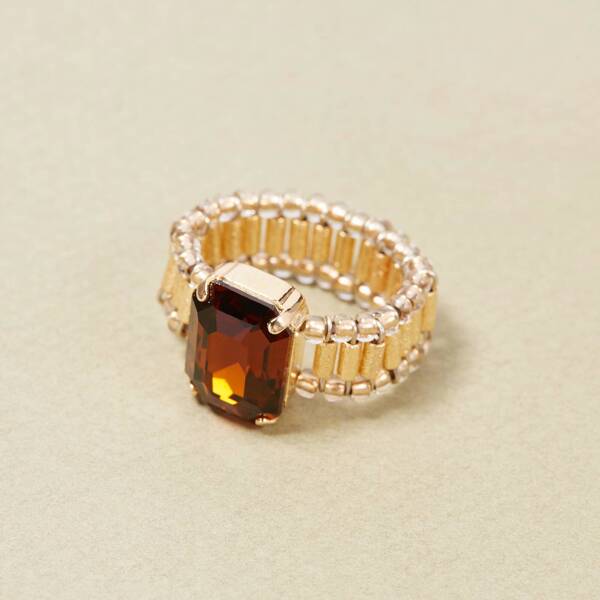 Delikatny, złocony pierścionek z fasetowanym kryształkiem. BRAZYLIJSKI RUM